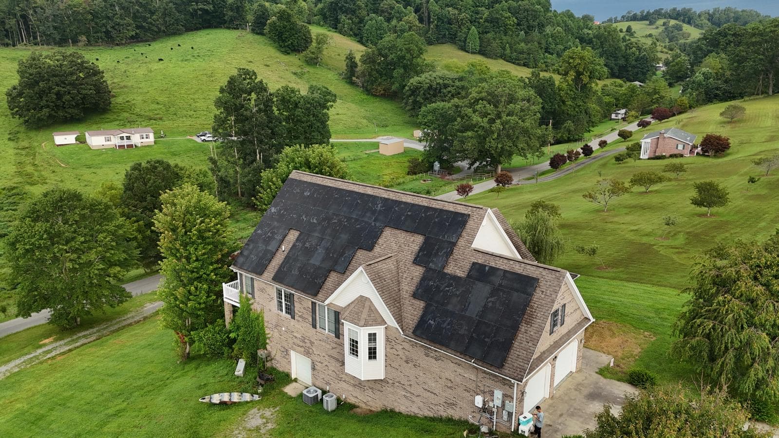 Aerial view of a completed residential rooftop solar array